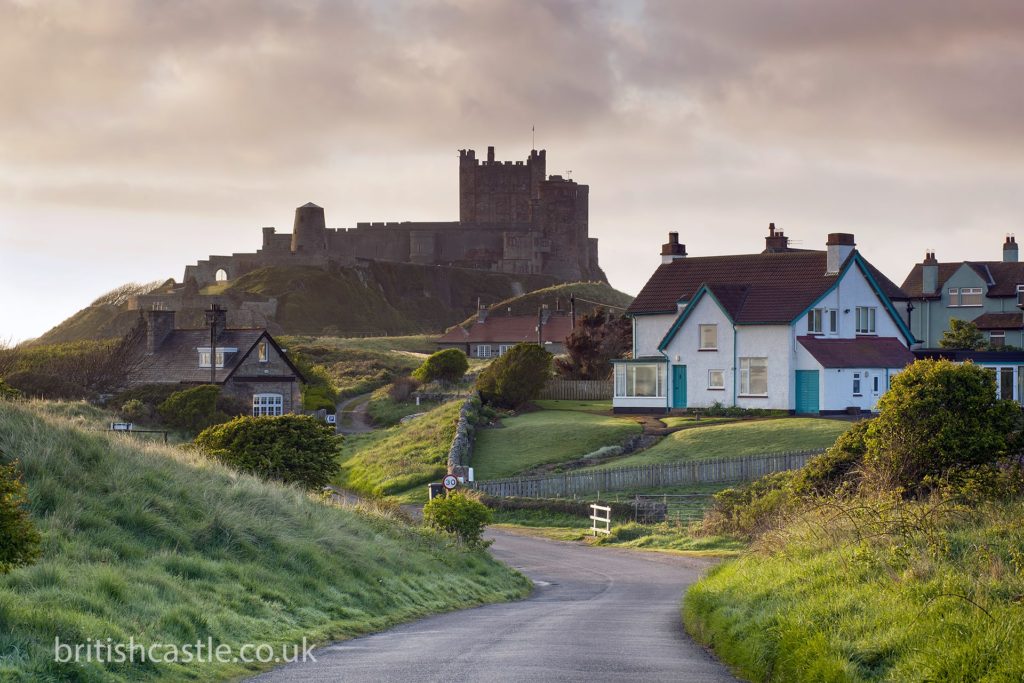 Bamburgh castle looms over the village
