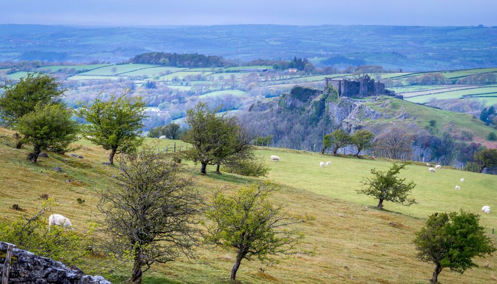 Carreg Cennen castle set in the Welsh countryside